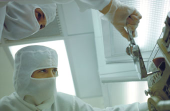 Nurse looking at x-ray in hospital room with anti static flooring